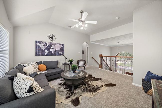 Upstairs game room looking out over front entry foyer. | Image 30