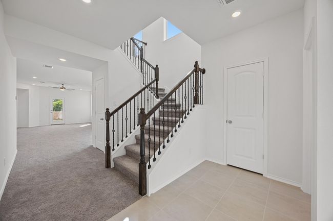 Beautiful iron spindled railing going up the stairs | Image 5