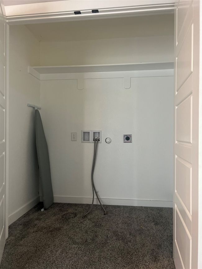 Laundry room with dark colored carpet, washer hookup, hookup for an electric dryer, and gas dryer hookup | Image 10