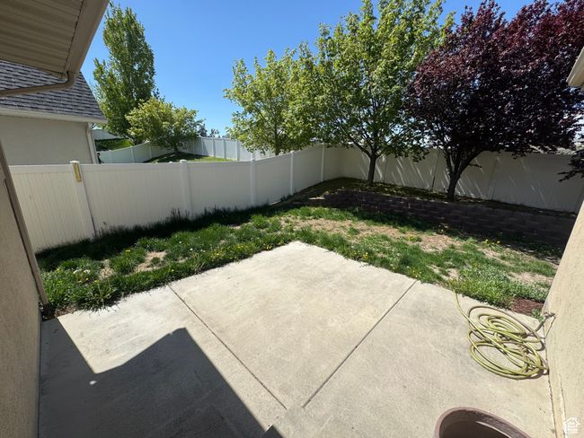 Fenced backyard featuring a patio area | Image 30