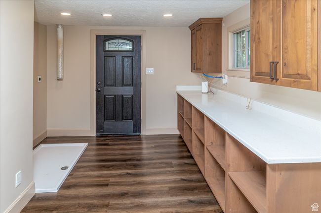 Entryway featuring a textured ceiling, dark wood-style floors, and recessed lighting | Image 42