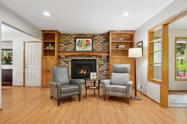 Warm & inviting gas fireplace with custom built-in cabinets | Image 9