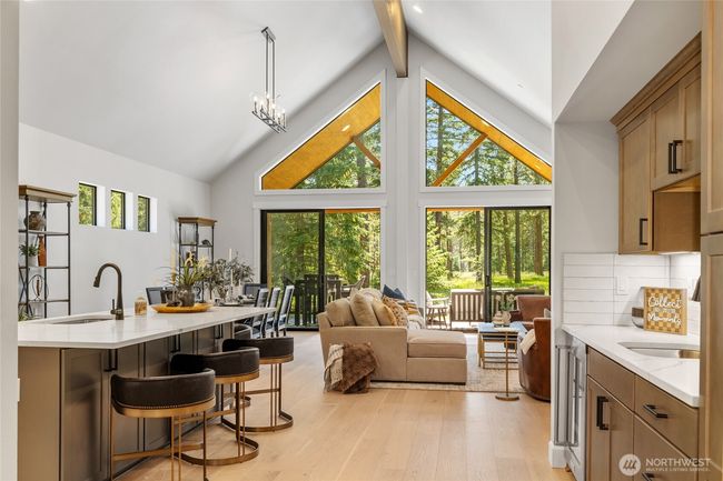 Plenty of light with soaring ceilings in great room, kitchen and dining. | Image 6