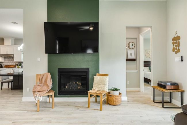 At the heart of the space, a fireplaceadds a cozy focal point, providingwarmth and charm. | Image 14