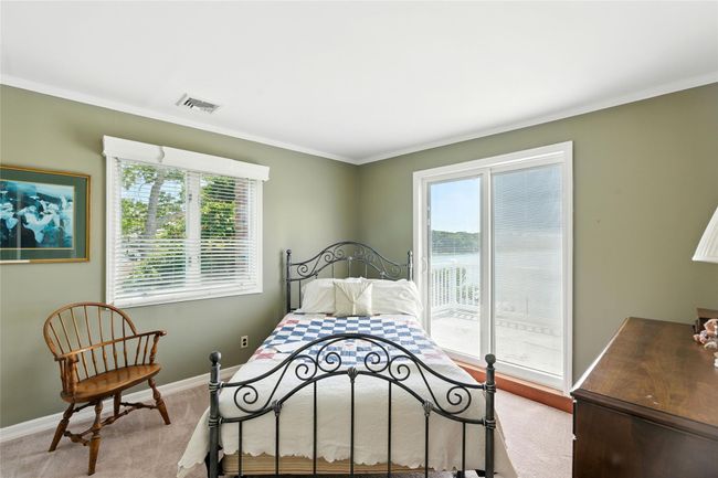 Bedroom with access to exterior, ornamental molding, and light colored carpet | Image 29