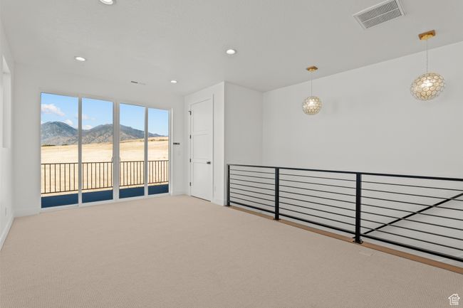 Unfurnished room with carpet, a mountain view, and recessed lighting | Image 29