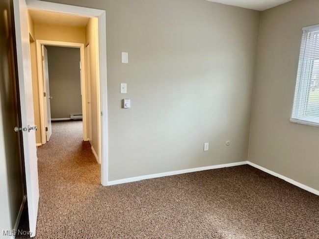Spare room with baseboards and carpet floors | Image 14