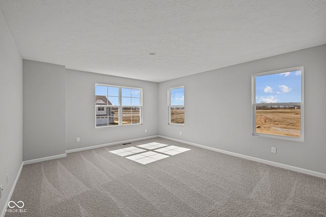 carpeted spare room featuring baseboards and a textured ceiling | Image 26