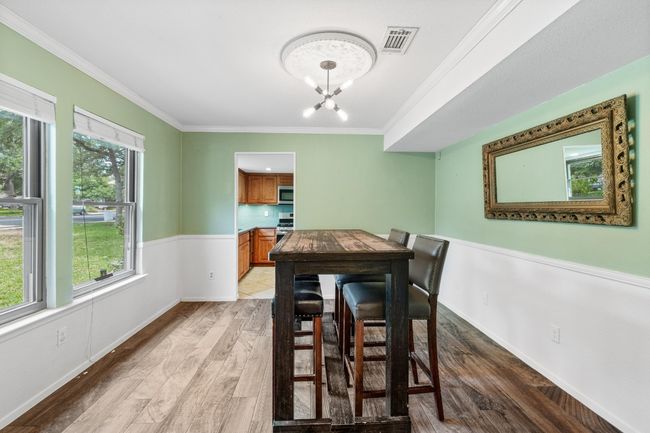 Surrounded by windows, this space catches the light beautifully throughout the day, adding warmth and atmosphere to everything from morning coffee to late-night chats | Image 13