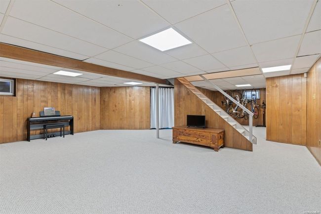 Finished basement with family room, laundry, utilities and storage | Image 18