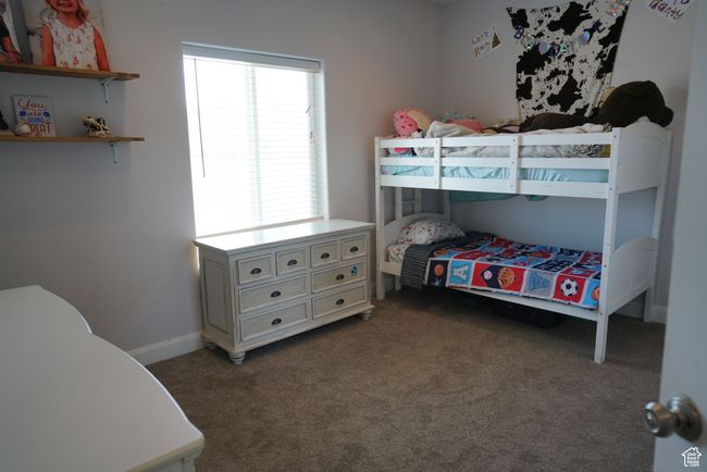 Carpeted bedroom with baseboards | Image 16