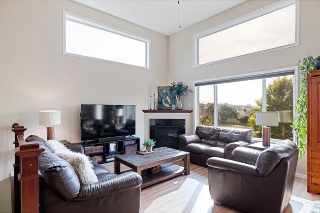 Don't miss the cozy corner fireplace to warm up during the cooler months. Did you see all these windows? | Image 11