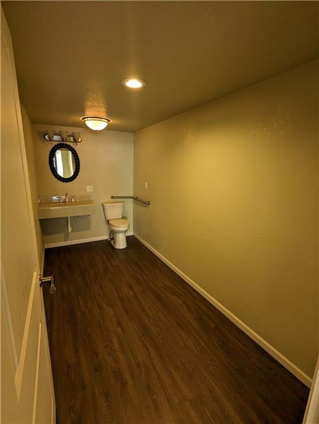 Laundry area featuring dark wood-type flooring | Image 10