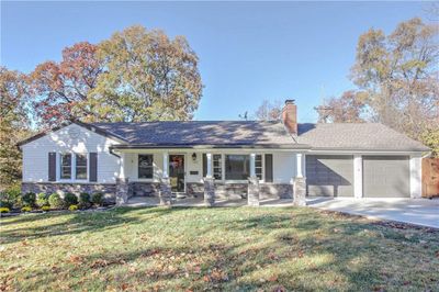 Totally remodeled home. Single story home featuring a stone columns covered porch, an two car garage | Image 1