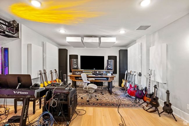 Miscellaneous room with visible vents, baseboards, recessed lighting, and wood finished floors | Image 85
