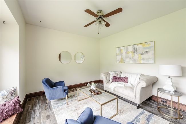 Living area with wood finished floors and ceiling fan | Image 20
