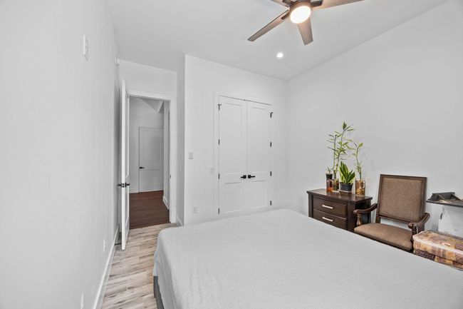 Bedroom featuring light wood finished floors, a closet, recessed lighting, and a ceiling fan | Image 24