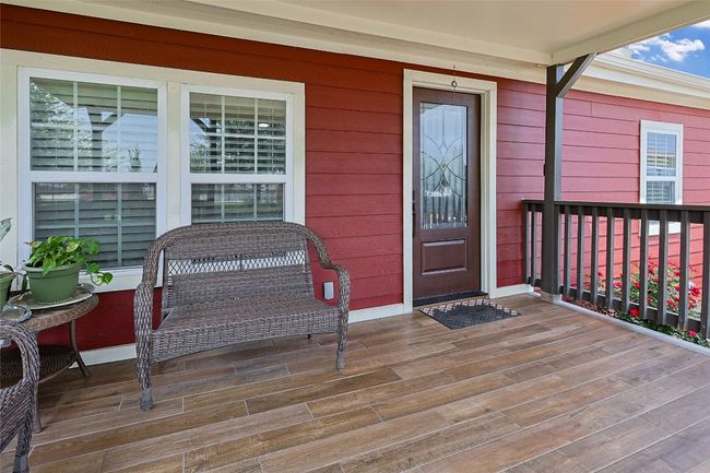 View of exterior entry featuring a porch | Image 5
