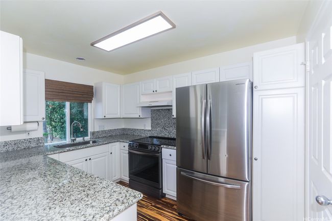 Kitchen view to the back window. | Image 7