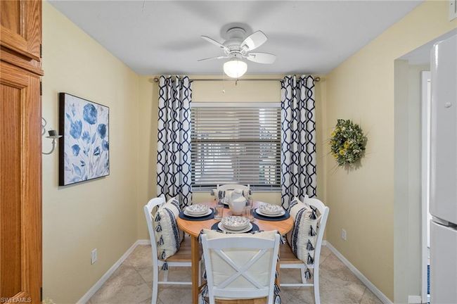 Dining room featuring ceiling fan | Image 10