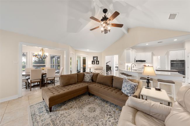 Main House living room open to kitchen and bar seating | Image 9