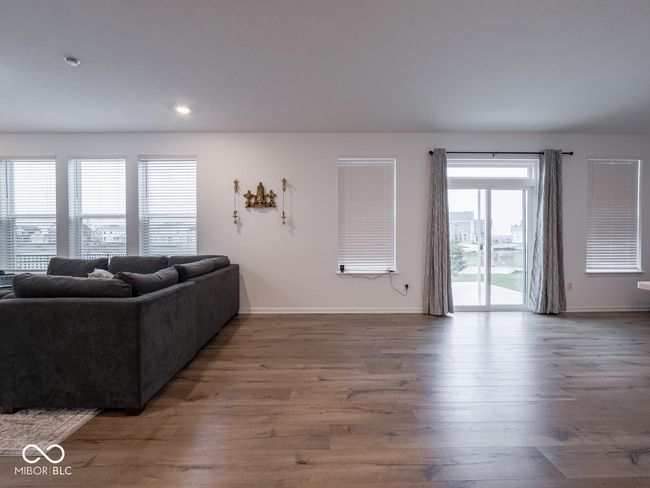 living room featuring baseboards, recessed lighting, and wood finished floors | Image 10