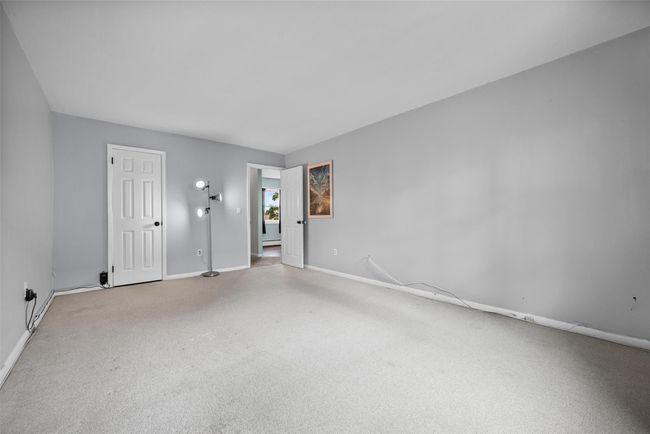 Empty room with light colored carpet and baseboards | Image 20