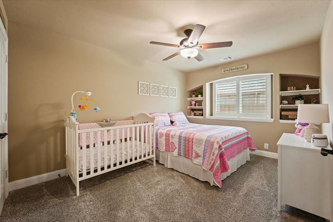 Bedroom featuring carpet, visible vents, a ceiling fan, and baseboards | Image 26