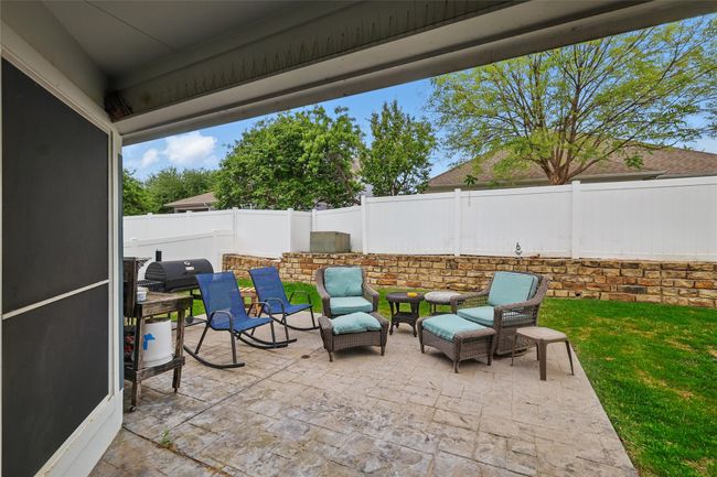 Fenced backyard featuring a patio area | Image 35