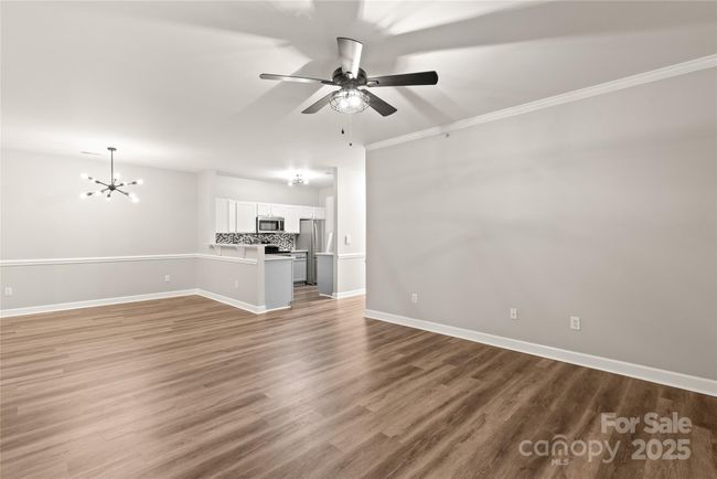 Never miss a beat when entertaining. Open to the dining area and kitchen. | Image 8