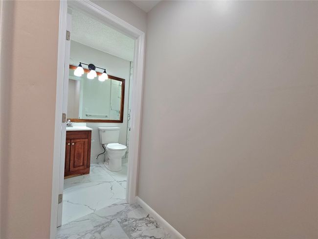 ENTRANCE TO THE BATHROOM | Image 13