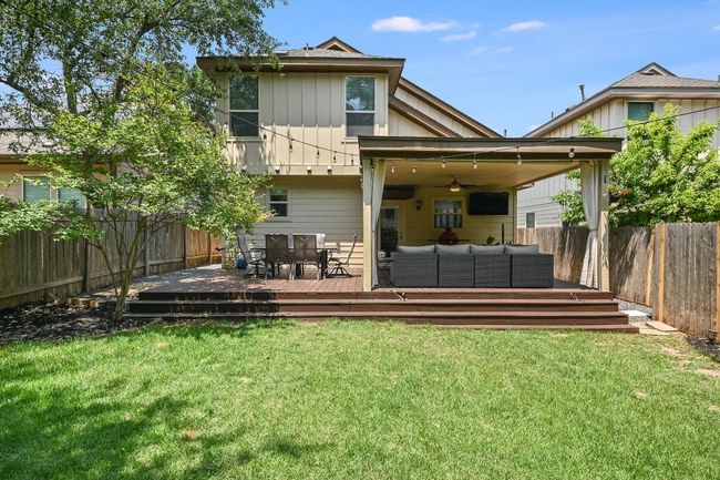 Rear view of property featuring an outdoor living space, a deck, ceiling fan, and board and batten​​‌​​​​‌​​‌‌​‌‌​​​‌‌​​‌‌​‌​​​​​‌ siding | Image 27