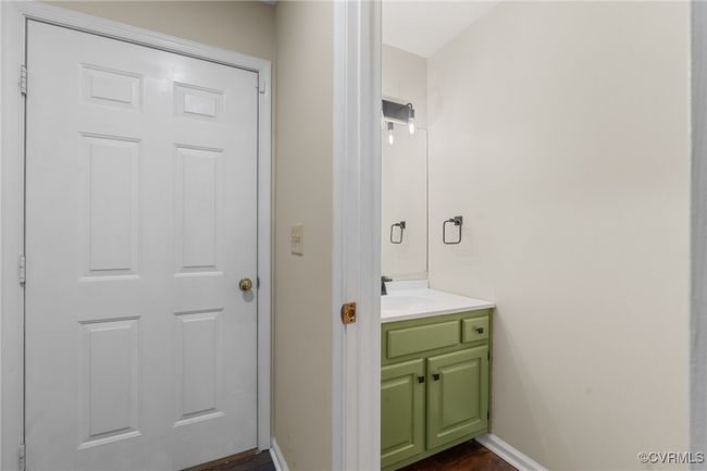Bathroom featuring baseboards, vanity, and wood finished floors | Image 22