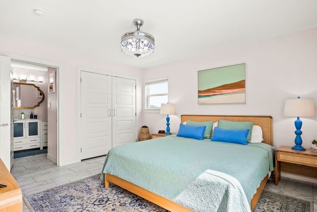 Spacious primary offering an ensuite bath, closet, and ocean views from both windows | Image 19