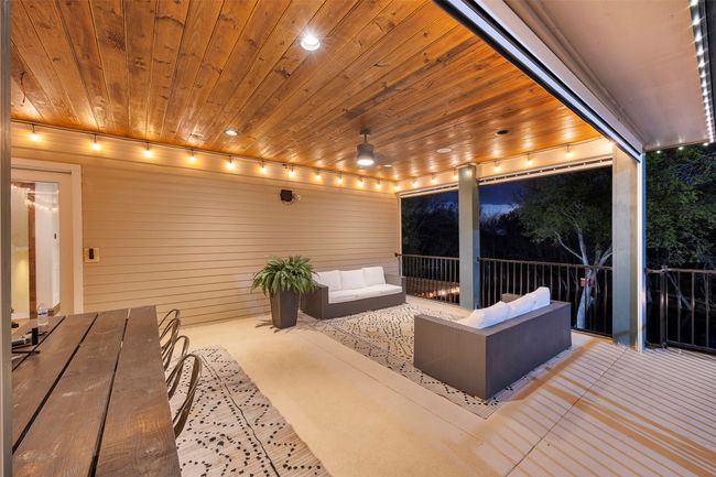 Main covered patio overlooking the pool and pond with built in TrimLights to enjoy year round holiday lighting. | Image 35