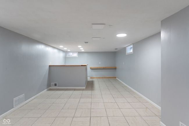 unfurnished room with bar, recessed lighting, and baseboards | Image 35
