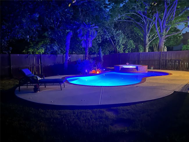 Pool at night featuring the purple lights. | Image 29