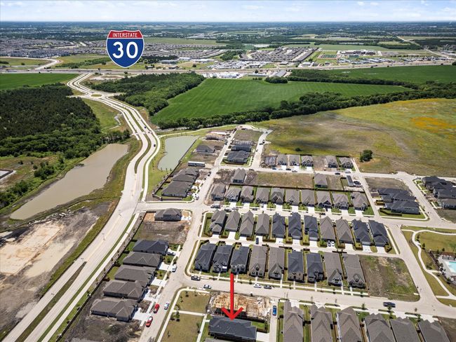 View of property location featuring nearby suburban area and a nearby body of water. | Image 26