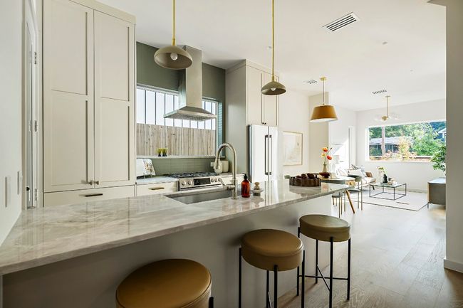 Kitchen wood finished floors, and a kitchen bar | Image 8