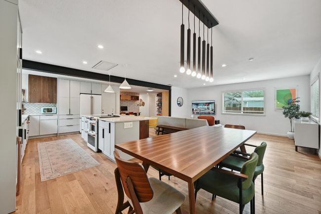 The spacious dining area opens seamlessly to the kitchen and living room which is ideal for entertaining. | Image 15