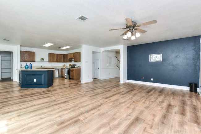 This shows how wide open this floor plan is....with luxury vinyl planking throughout all the first floor living spaces! | Image 8