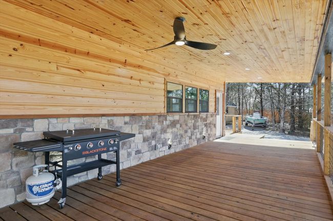 Wooden deck featuring a ceiling fan | Image 14