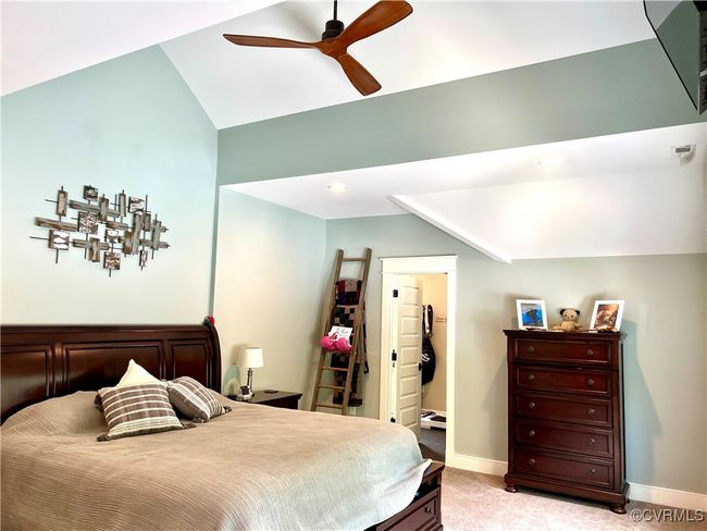 Upstairs Primary Bedroom with a ceiling fan, and vaulted ceiling | Image 28