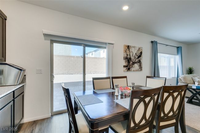 Dining area featuring baseboards and light wood-type flooring | Image 28