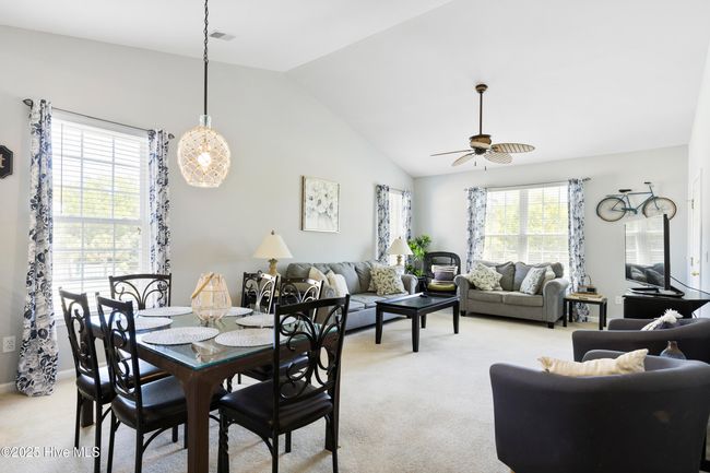 Dining area with table and chairs for 6 and 4 at the breakfast bar! | Image 12