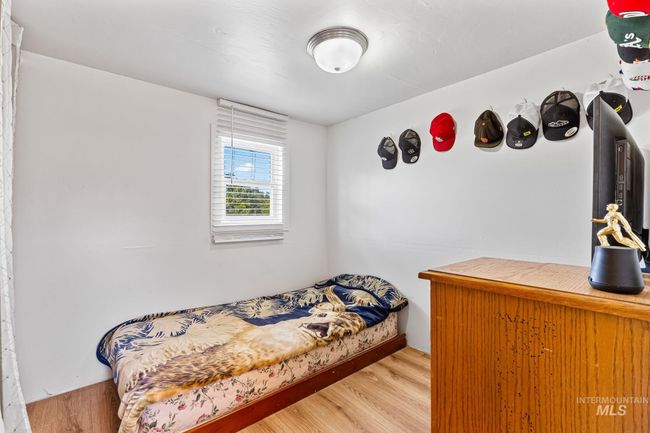 Bedroom featuring wood finished floors | Image 13