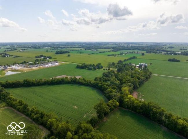 aerial view of sparsely populated area with agricultural land | Image 10