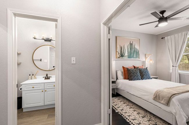 Main-level guest bedroom featuring easy access to a full bathroom | Image 12