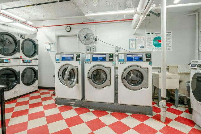 Community laundry featuring tile patterned floors, washer and clothes dryer, and stacked washing machine and dryer | Image 18