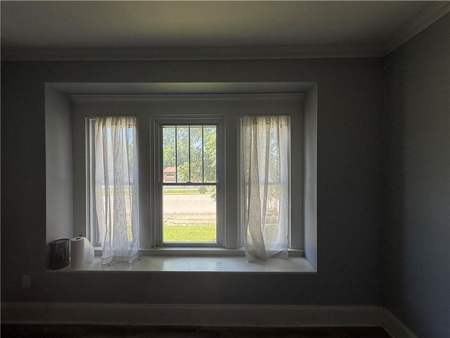 Detailed view of crown molding and baseboards | Image 36